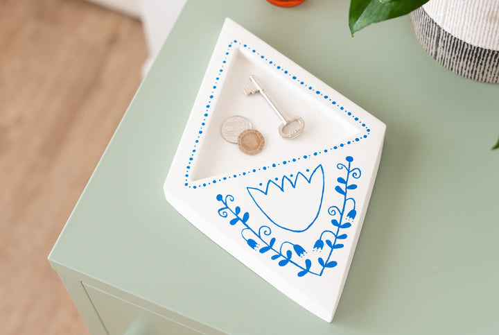Diamond shaped white concrete dish with indent tray, with blue folk art painting decor
